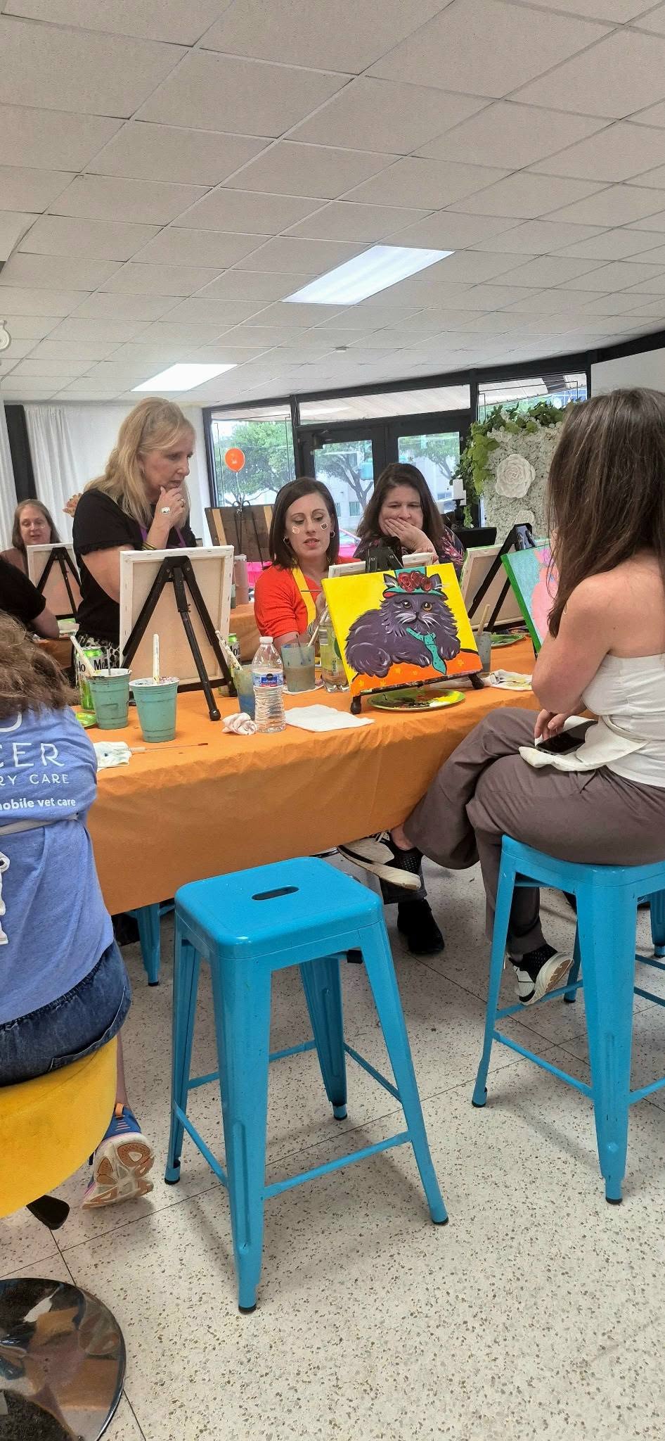Guests enjoying a relaxed BYOB paint party evening